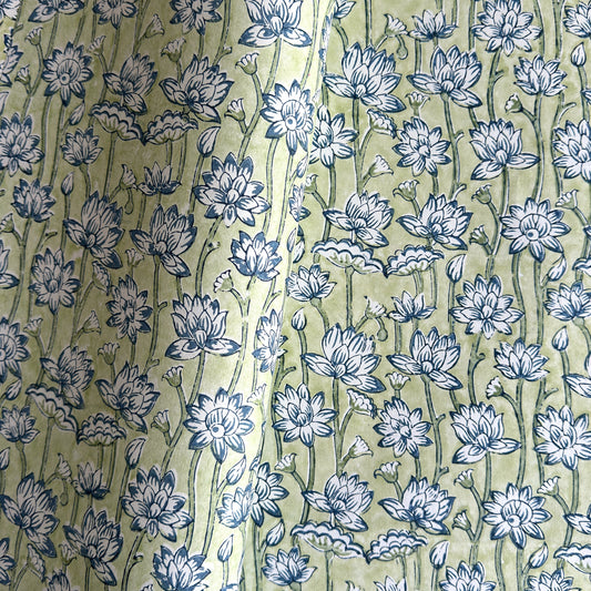 hand block printed wrapping paper with a repeat lotus flower design in indigo and light green. By Paper Mirchi