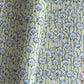 hand block printed wrapping paper with a repeat lotus flower design in indigo and light green. By Paper Mirchi