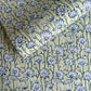 hand block printed wrapping paper with a repeat lotus flower design in indigo and light green. By Paper Mirchi