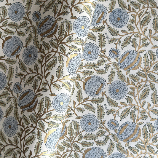 wrapping paper with repeat botanical pattern in blue, gold and green by Paper Mirchi