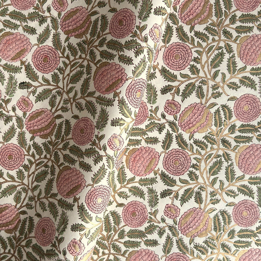 wrapping paper with repeat botanical pattern in pink, gold and green by Paper Mirchi
