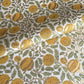 wrapping paper with repeat botanical pattern in yellow, gold and green by Paper Mirchi