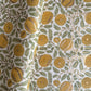 wrapping paper with repeat botanical pattern in yellow, gold and green by Paper Mirchi