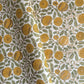 wrapping paper with repeat botanical pattern in yellow, gold and green by Paper Mirchi