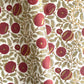 hand block printed paper by Paper Mirchi.  A floral repeat pattern in deep burgundy, pale green and gold.