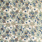hand block printed wrapping paper with a pomegranate design in indigo and green with gold accent. By Paper Mirchi