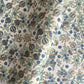 hand block printed wrapping paper with a pomegranate design in indigo and green with gold accent. By Paper Mirchi
