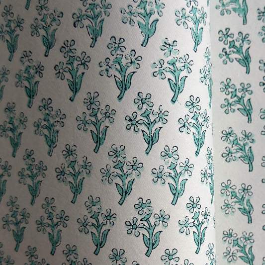 wrapping paper with repeat block print little floral pattern in aqua by Paper Mirchi