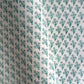 wrapping paper with repeat block print little floral pattern in aqua by Paper Mirchi