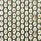 a sheet of block printed paper with a dark green backdrop and white oval scallops with winter foliage motif in the centre