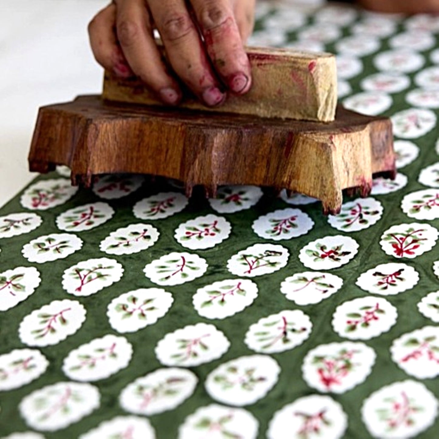 close up of a sheet of paper being hand block printed