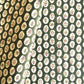 a sheet of block printed paper with a dark green backdrop and white oval scallops with winter foliage motif in the centre