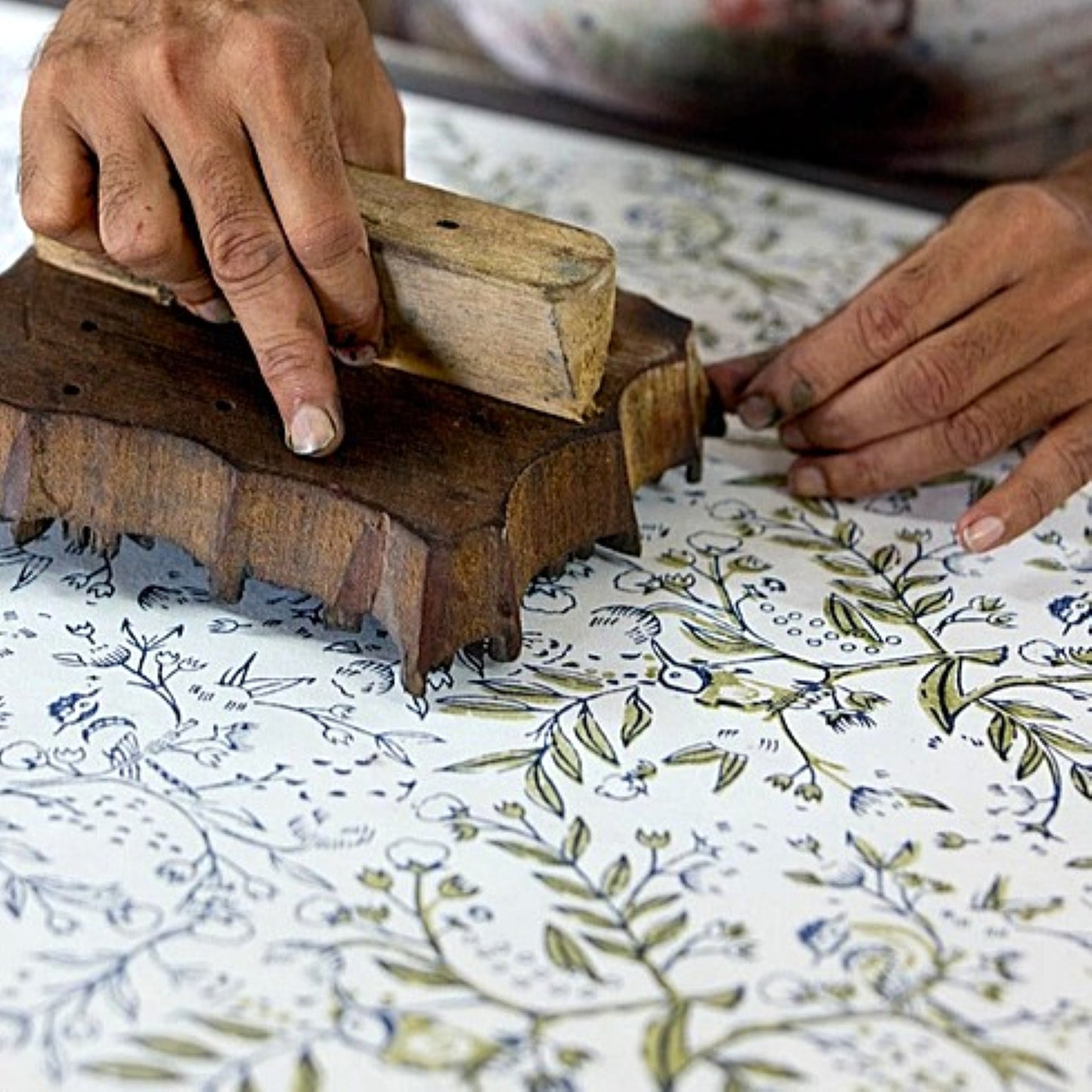 a close up of a wooden block used for hand block printing cotton paper