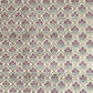 hand block printed wrapping paper by Paper Mirchi.  Repeat pattern of little flowers in pink and green within a gold trellis design.