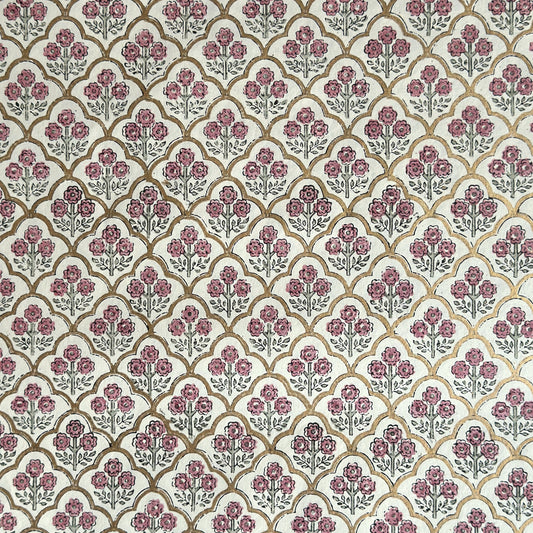 hand block printed wrapping paper by Paper Mirchi.  Repeat pattern of little flowers in pink and green within a gold trellis design.