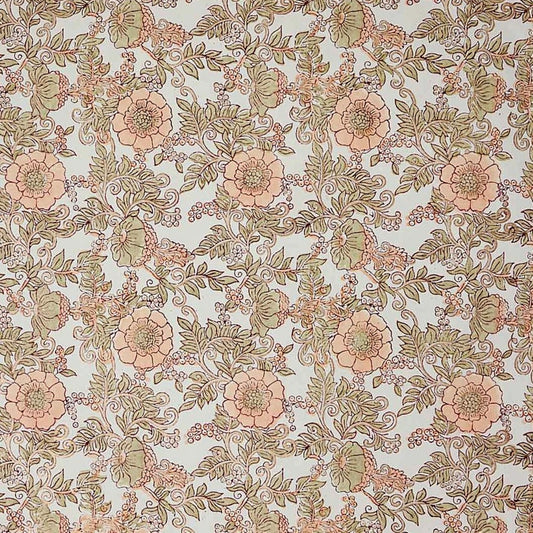 a hand block printed sheet of wrapping paper with a wild rose design in coral, moss green on a white background