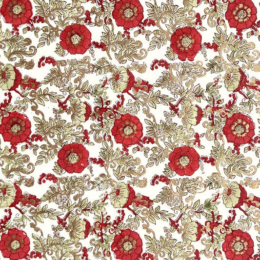 a sheet of hand block printed wrapping paper with a wild rose repeat design in scarlet red with soft green leaves and gold accents