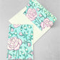 hand block printed greetings card with repeat floral pattern in pink and aqua, by Paper Mirchi