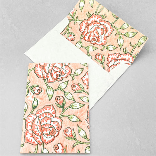 hand block printed greetings card with repeat floral pattern in coral and green, by Paper Mirchi