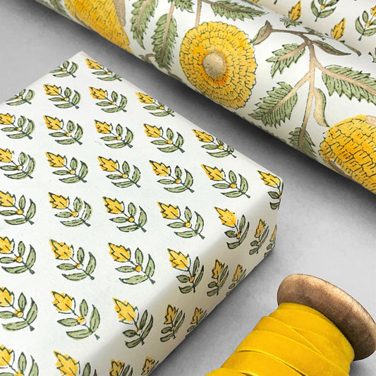 Wrapping paper with block print small flower motif in yellow and green, white background by Paper Mirchi