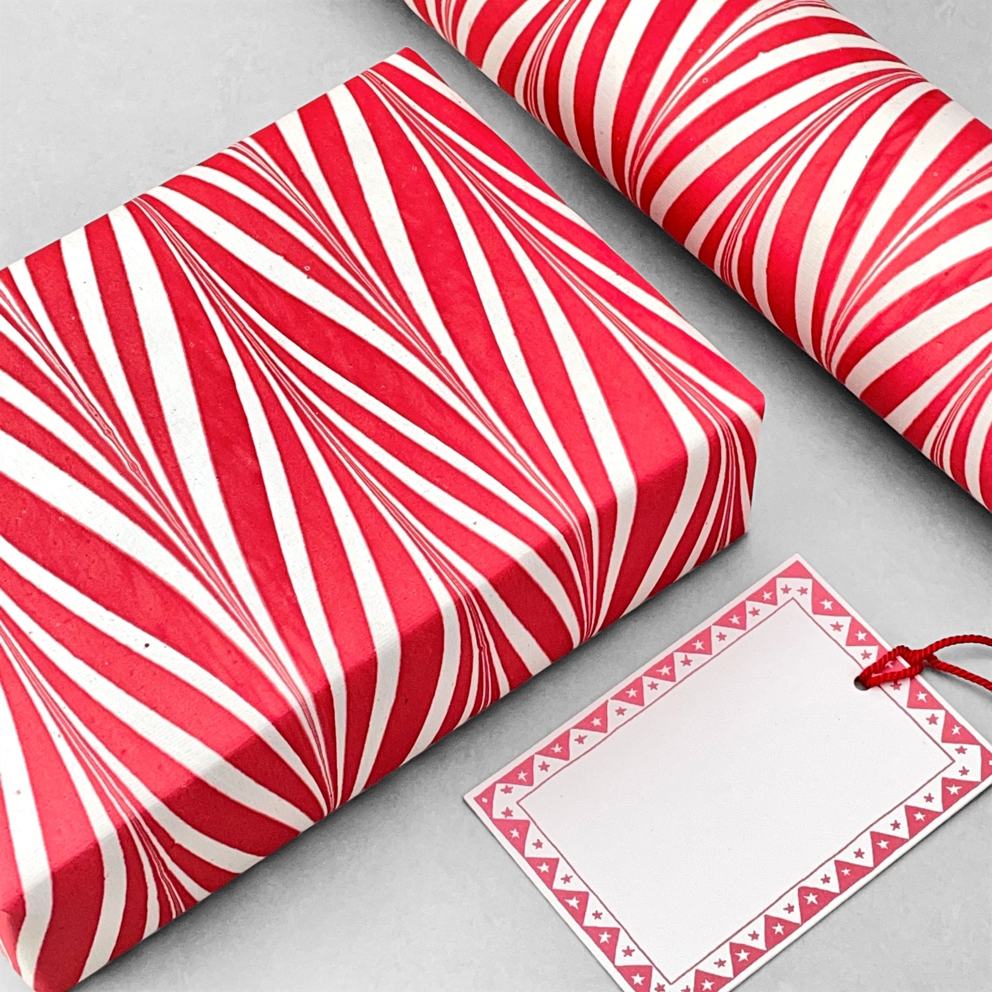 wrapping paper with marbled chevron pattern in red and white by Paper Mirchi