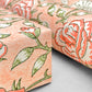 wrapping paper with repeat botanical rose pattern in coral and green by Paper Mirchi