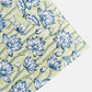 hand block printed wrapping paper with a repeat lotus flower design in indigo and light green. By Paper Mirchi