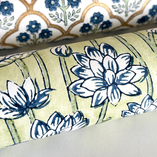 hand block printed wrapping paper with a repeat lotus flower design in indigo and light green. By Paper Mirchi. close up