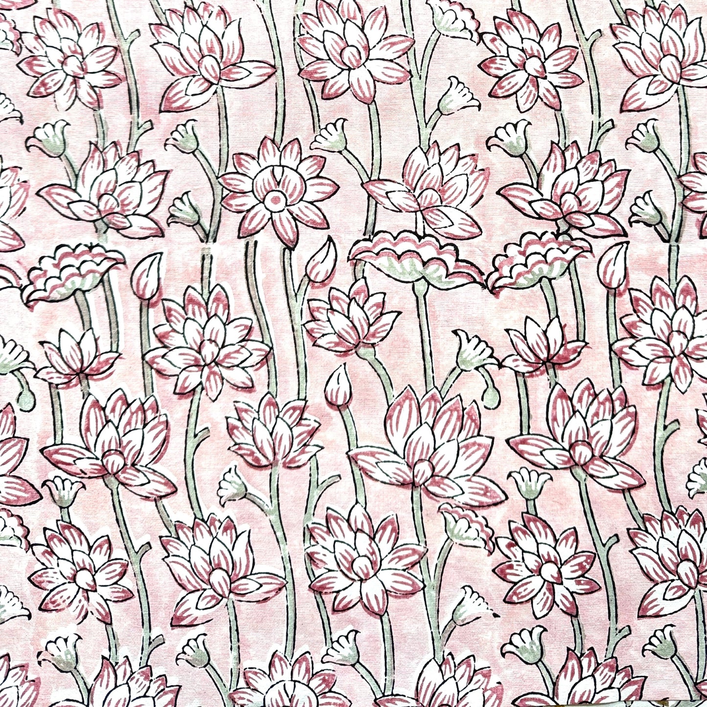 hand block printed wrapping paper by Paper Mirchi. Lotus flower repeat pattern in pale pink