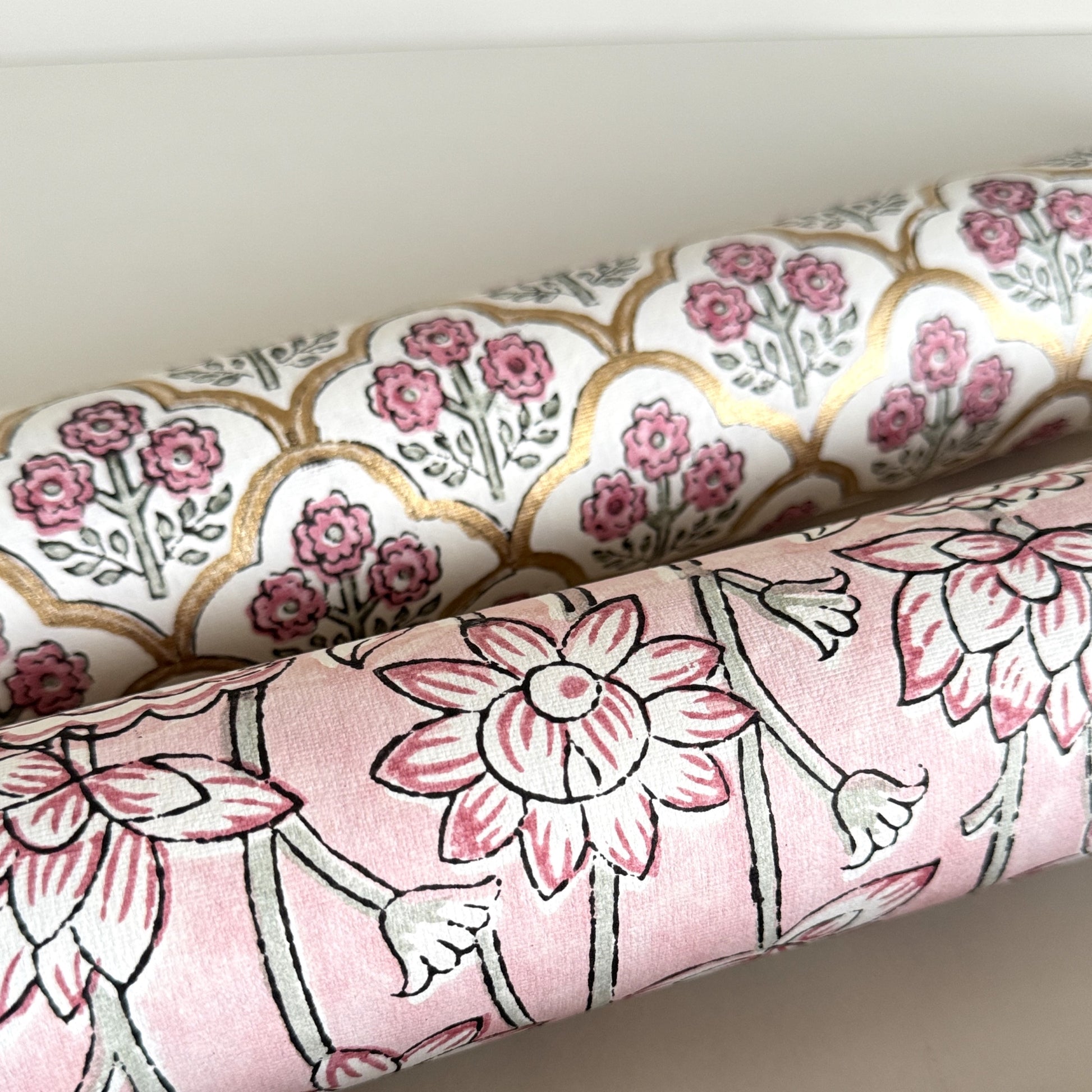 hand block printed wrapping paper by Paper Mirchi. Lotus flower repeat pattern in pale pink, close-up