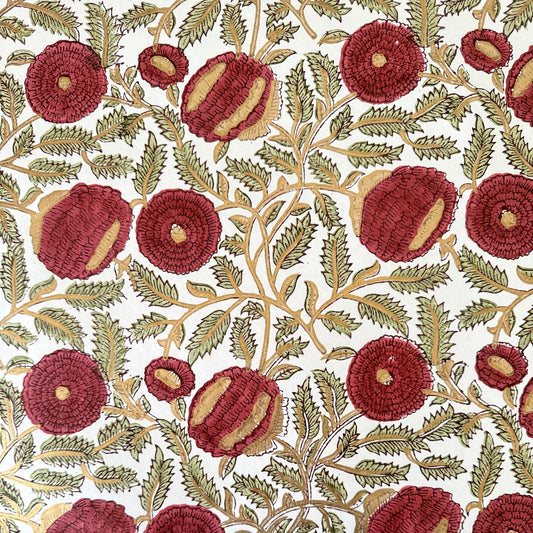 hand block printed paper by Paper Mirchi.  A floral repeat pattern in deep burgundy, pale green and gold.