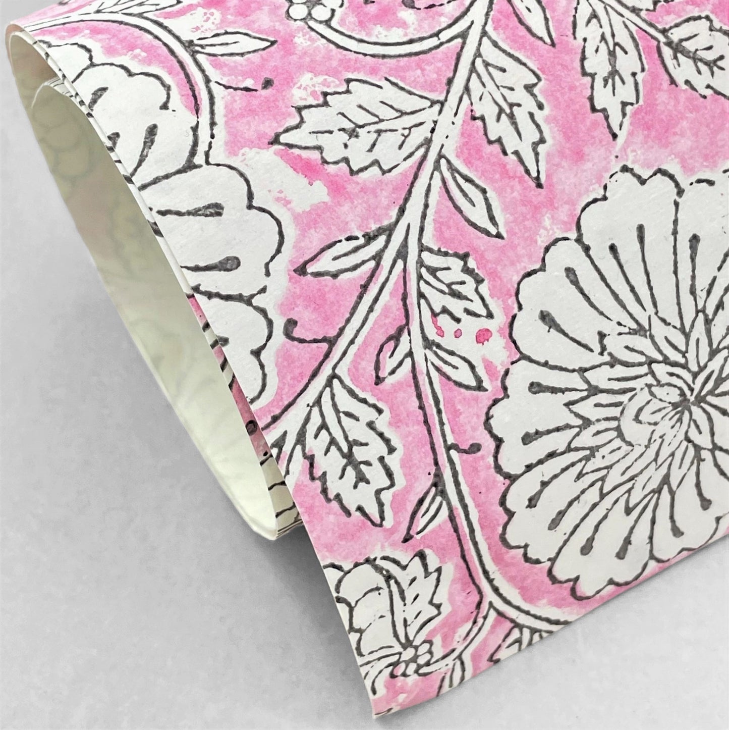 wrapping paper with repeat botanical pattern in pink by Paper Mirchi