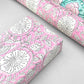 wrapping paper with repeat botanical pattern in pink by Paper Mirchi