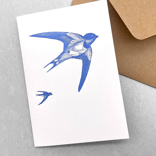 letterpress greetings card of a drawing of a swallow in flight, blue ink on white by Passenger Press