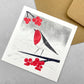 A pack of 4 cards with different designs inspired by snowfall, by Ruth Thorp Studio. A robin with berries.