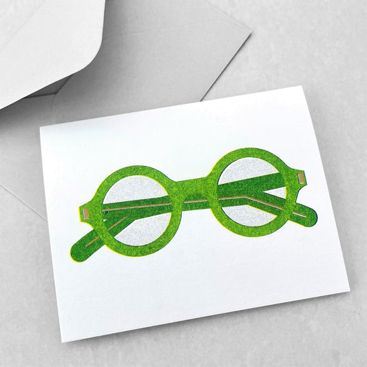 Mini greetings card with an image of a green pair of spectacles. By Scout Editions.