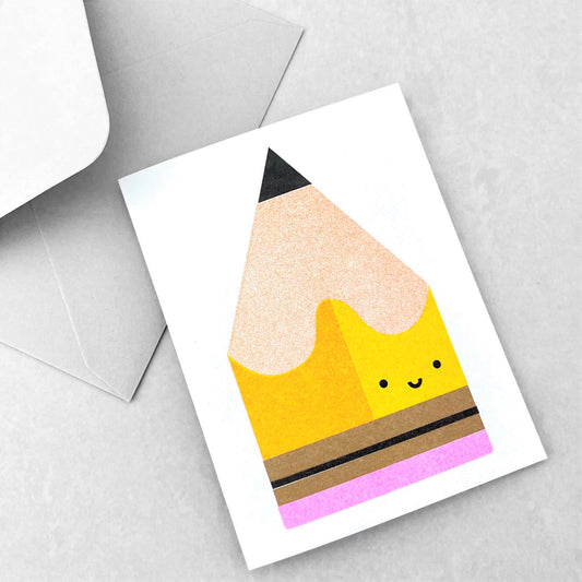Mini greetings card with an image of a yellow pencil with a smily face. By Scout Editions.