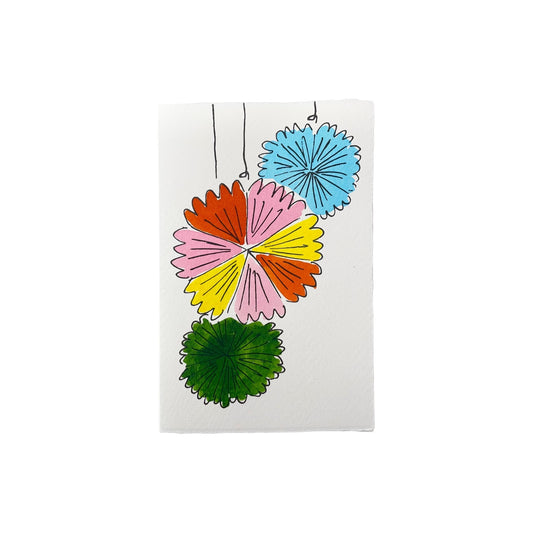 A letterpress printed card by Scribble & Daub.  Three pinwheel decorations hand painted in a bright 70s colour palette of pink, red, yellow, light blue and green