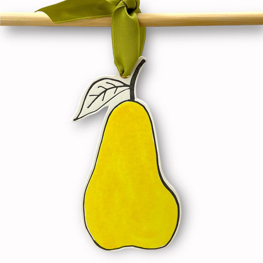 a pear shaped hanging ornament made of thick 1050gsm off-white card, letterpress printed in black and then hand painted in bright yellow ink.  It has a chartreuse green satin ribbon to hang the ornament with.  By Scribble & Daub