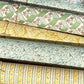 rolls of florentine remondini wrapping papers with patterns in green, yellow and blue