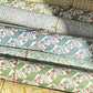 italian florentine wrapping papers rolled, various designs in colours of green, blue and yellow 