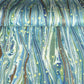 a sheet of Italian printed marbled wrapping paper by Tassotti with a marble pattern in aqua, blue, green, white an gold