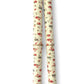 a sheet of italian wrapping paper with a vintage Liberty style floral pattern in red and green on cream. Pictured rolled