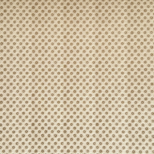 a sheet of italian wrapping paper with gold snowflakes on a cream backdrop. 