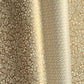 a sheet of Italian wrapping paper by Tassotti, the design is from the Remondini archives and is a small scale botanical block print on an antique gold ground, pictured alongside another paper in with a geometric gold and white pattern