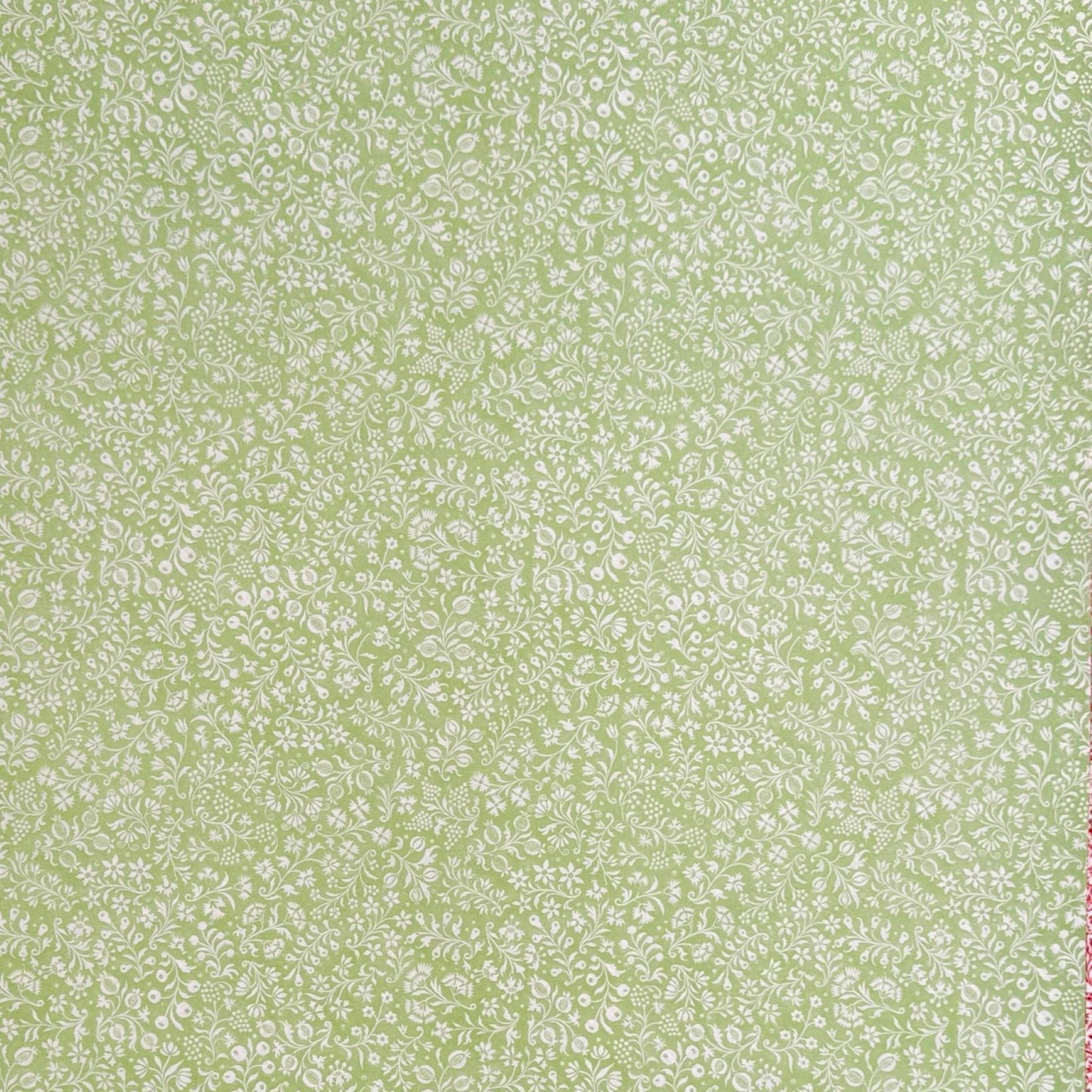 a sheet of italian wrapping paper with a delicate small floral design in light green and white