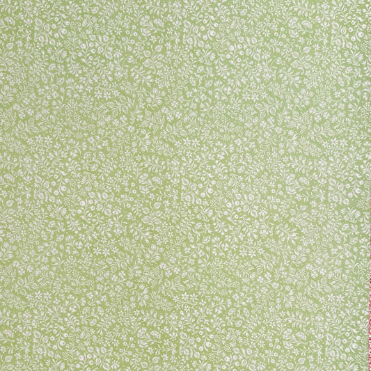 a sheet of italian wrapping paper with a delicate small floral design in light green and white