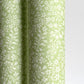 a sheet of italian wrapping paper with a delicate small floral design in light green and white