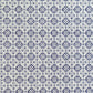 a sheet of italian wrapping paper with a blue block print repeat stamp pattern on white.