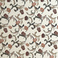 a sheet of italian wrapping paper with a multicoloured large floral pattern on cream paper 